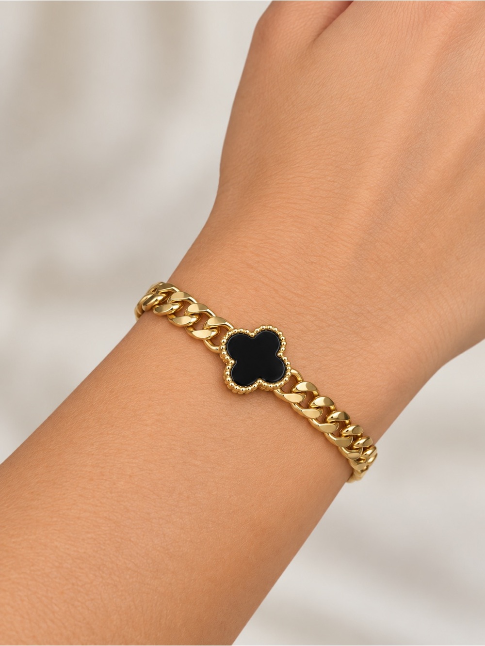 Gold Chain Bracelet with Black Clover Accent